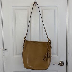 Coach cross body tassel bag